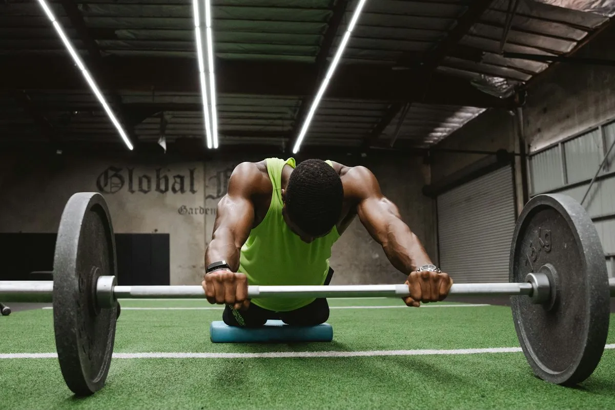 An athlete preparing to lift a barbell in a studio